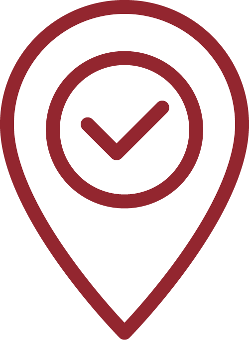 Icon of a location pin with a checkmark inside of it